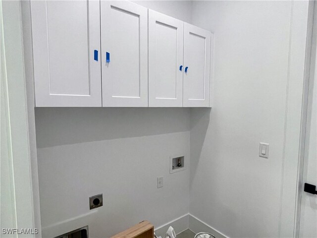 442 4th St SE, Naples, FL 34117 - washroom with hookup for an electric dryer, hookup for a washing machine, cabinet space, and baseboards