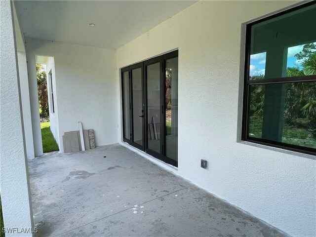 442 4th St SE, Naples, FL 34117 - view of patio / terrace with french doors