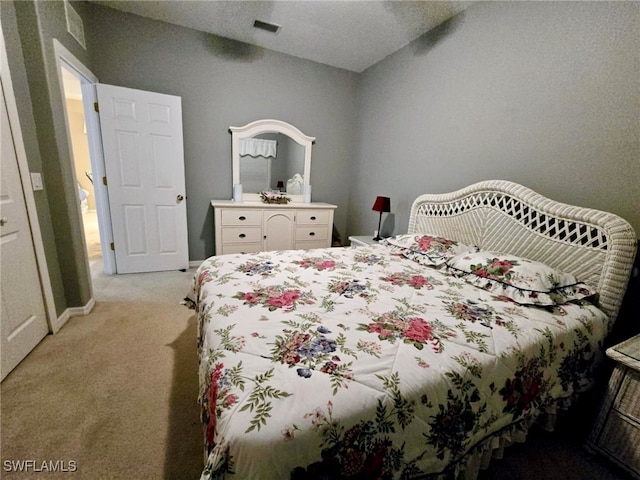 bedroom featuring light carpet