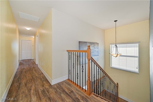 hallway with dark hardwood / wood-style flooring