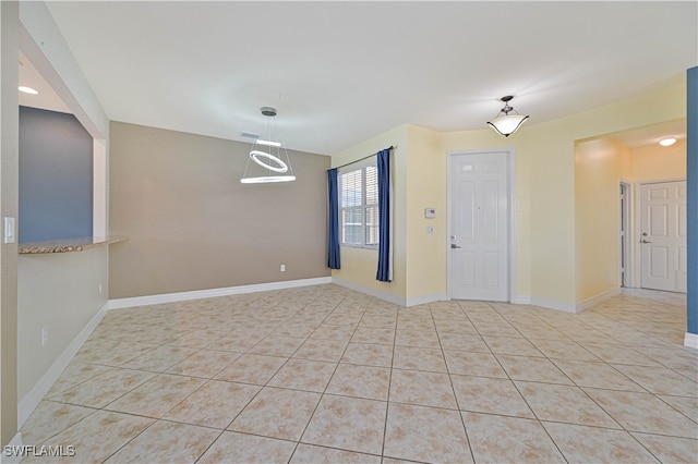 empty room featuring light tile patterned floors