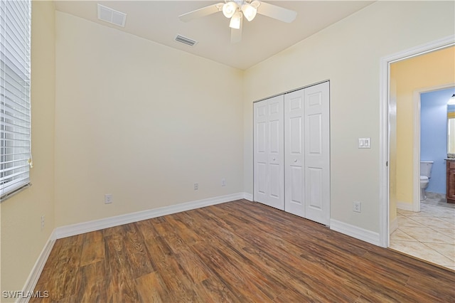 unfurnished bedroom featuring a closet, ceiling fan, and light hardwood / wood-style flooring