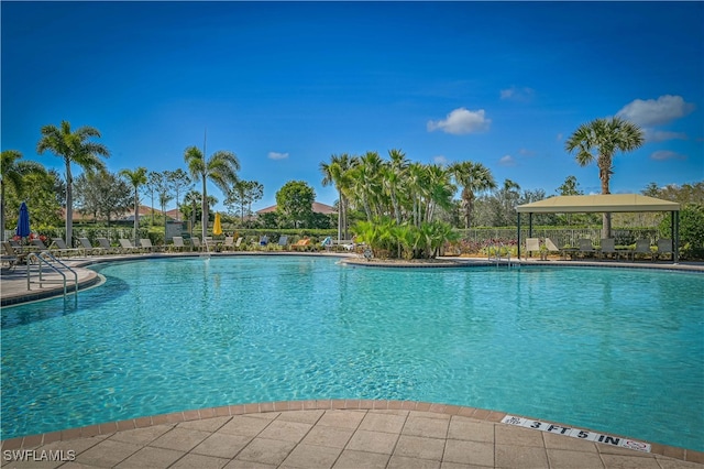 view of swimming pool featuring a patio area