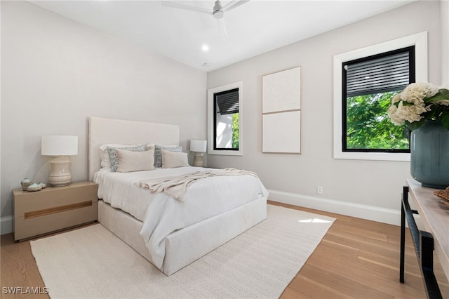 bedroom with ceiling fan and hardwood / wood-style floors