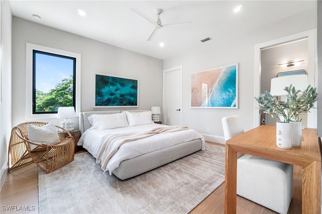 bedroom featuring ceiling fan and wood-type flooring