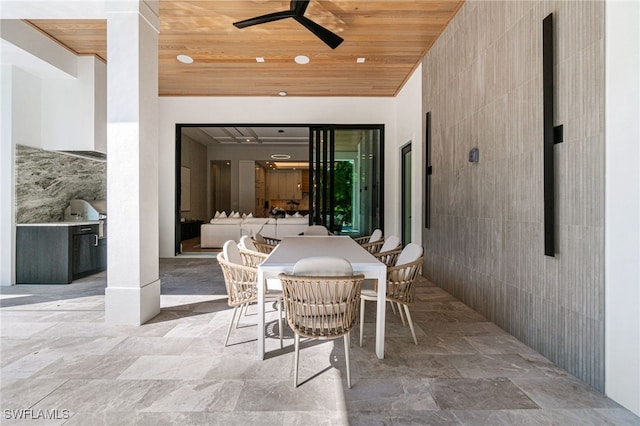 view of patio / terrace with ceiling fan and an outdoor kitchen