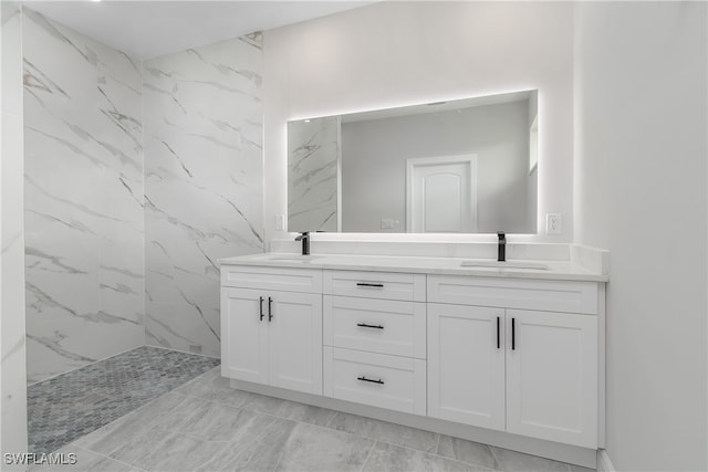 bathroom featuring vanity and a tile shower