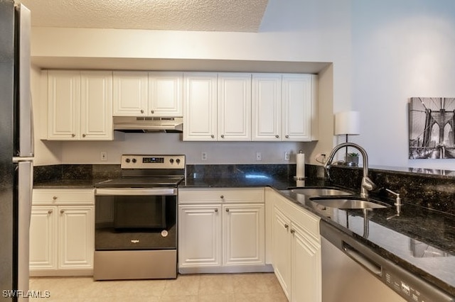 kitchen with sink, white cabinets, a textured ceiling, and appliances with stainless steel finishes