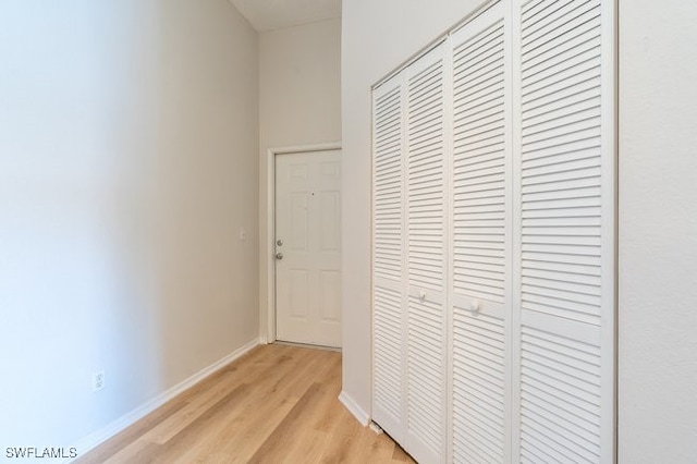 hall with light hardwood / wood-style floors