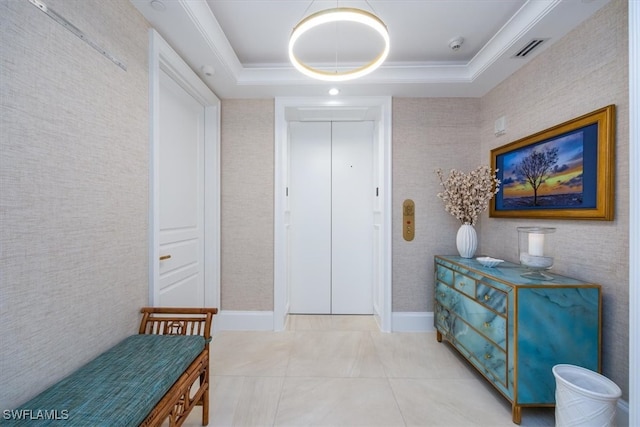 hallway with a raised ceiling, elevator, and tile patterned floors