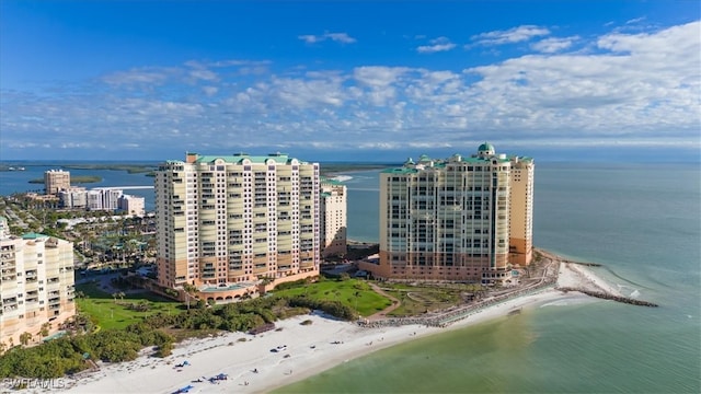 birds eye view of property featuring a water view and a view of the beach