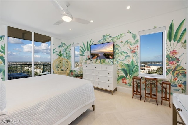 bedroom featuring access to exterior, ceiling fan, and multiple windows