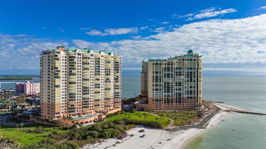 view of property featuring a water view and a view of the beach