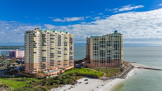 view of property featuring a water view and a view of the beach