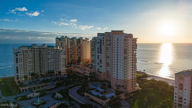 outdoor building at dusk featuring a water view