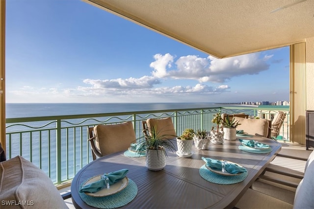 balcony featuring a water view