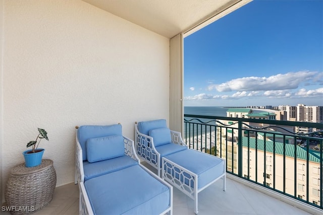 balcony featuring a water view