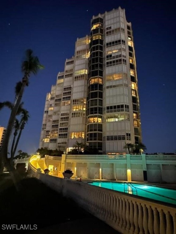 view of building exterior with a community pool