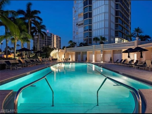 view of swimming pool with a patio