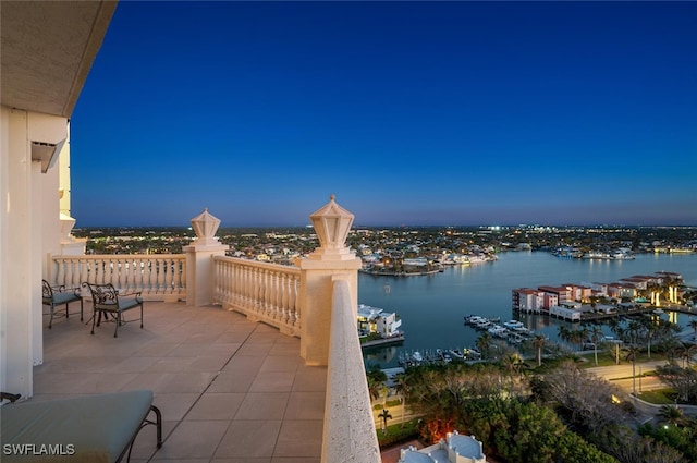 patio terrace at dusk with a water view