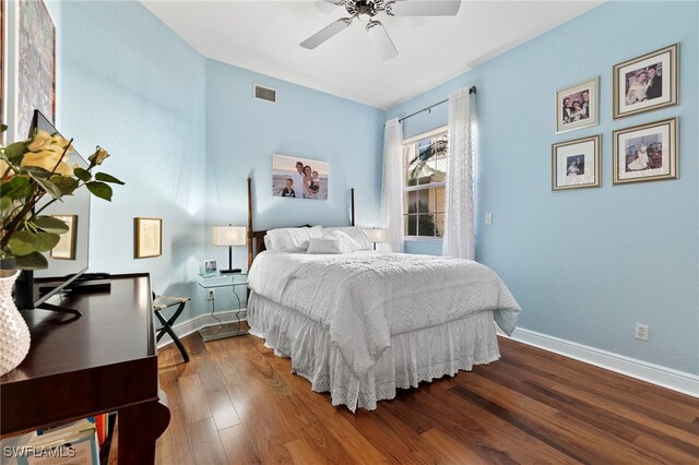 bedroom with wood-type flooring and ceiling fan