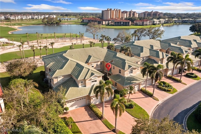 birds eye view of property with a water view and a residential view