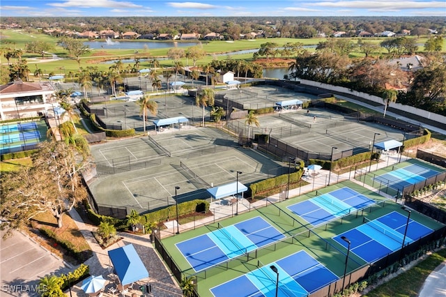 aerial view featuring view of golf course and a water view