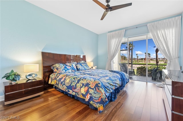 bedroom featuring wood finished floors, a ceiling fan, and access to outside