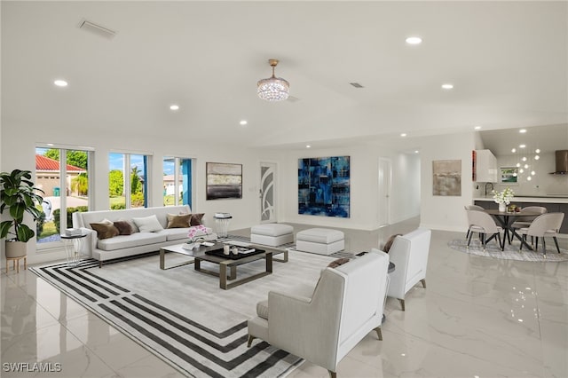 living room featuring recessed lighting, marble finish floor, visible vents, and vaulted ceiling