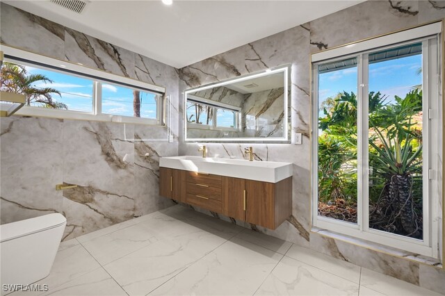 bathroom with vanity and toilet