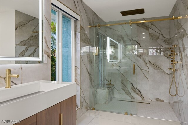 bathroom featuring vanity and an enclosed shower