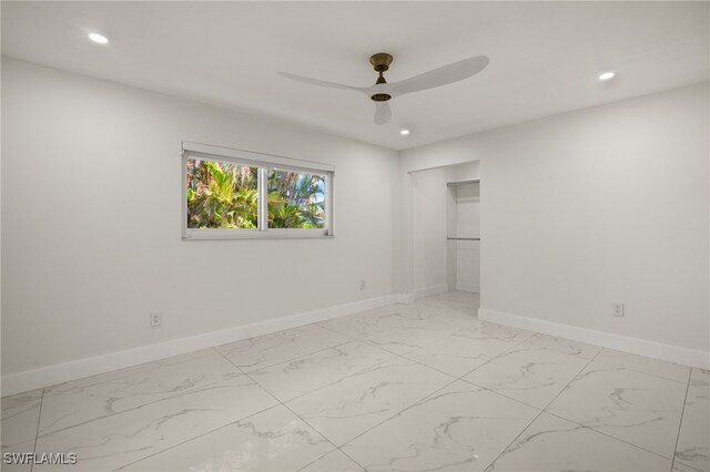 unfurnished room featuring ceiling fan