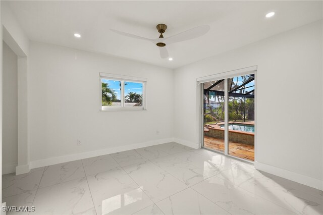 unfurnished room with ceiling fan