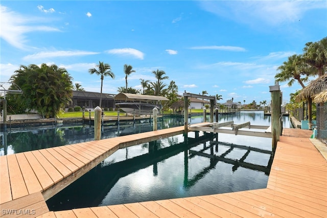 view of dock featuring a water view and boat lift