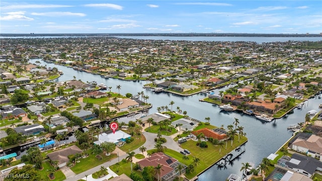 bird's eye view featuring a residential view and a water view