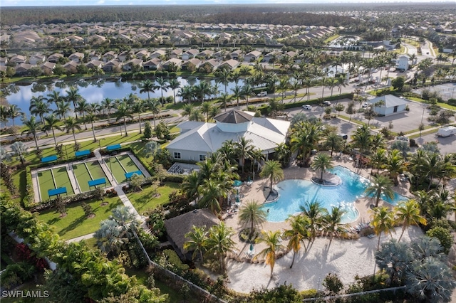 birds eye view of property with a water view