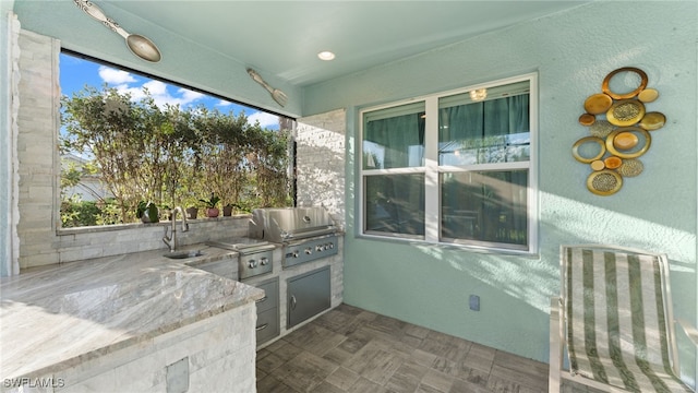 view of patio featuring grilling area, area for grilling, and sink