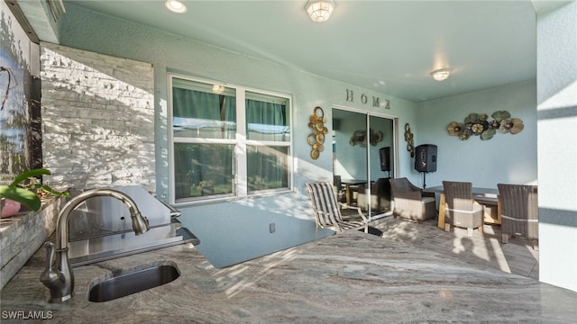 view of patio featuring sink and exterior kitchen