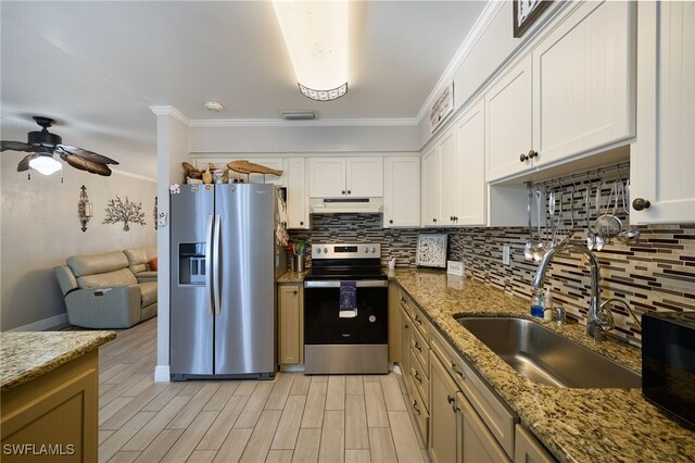 kitchen featuring sink, white cabinets, ornamental molding, and appliances with stainless steel finishes