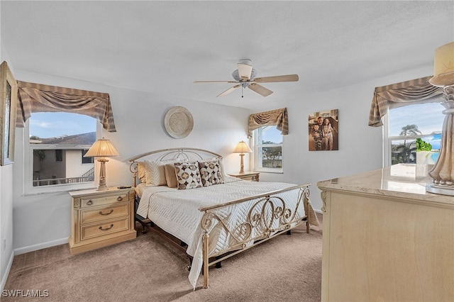 bedroom with light carpet and ceiling fan