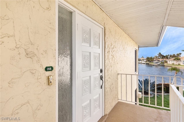 entrance to property featuring a water view