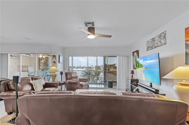 living room with ceiling fan and crown molding