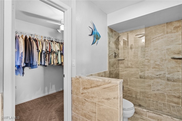 bathroom with toilet and tiled shower