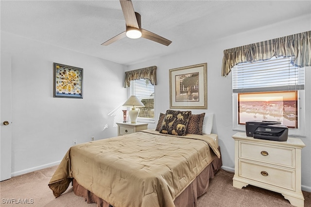 bedroom with light carpet and ceiling fan