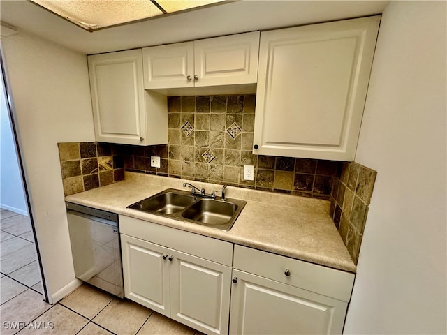 kitchen with backsplash, white cabinets, sink, dishwasher, and light tile patterned flooring