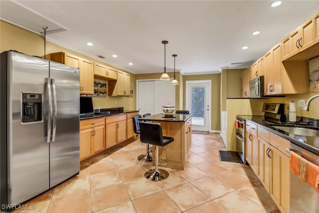 kitchen with light brown cabinets, stainless steel appliances, a kitchen island, and sink