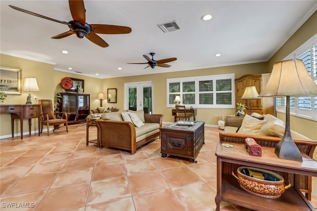 living room featuring french doors, light tile patterned floors, ceiling fan, and crown molding