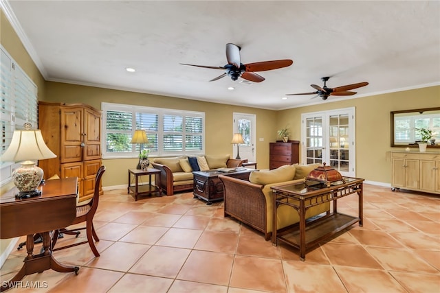 living room featuring light tile patterned floors, ceiling fan, and crown molding