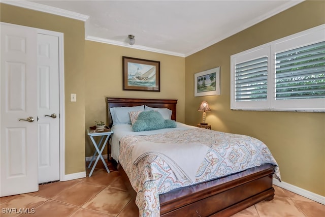 bedroom featuring tile patterned flooring and crown molding