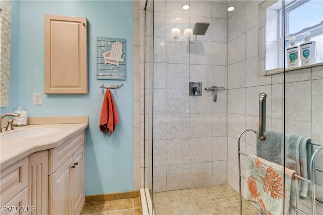 bathroom with vanity and an enclosed shower